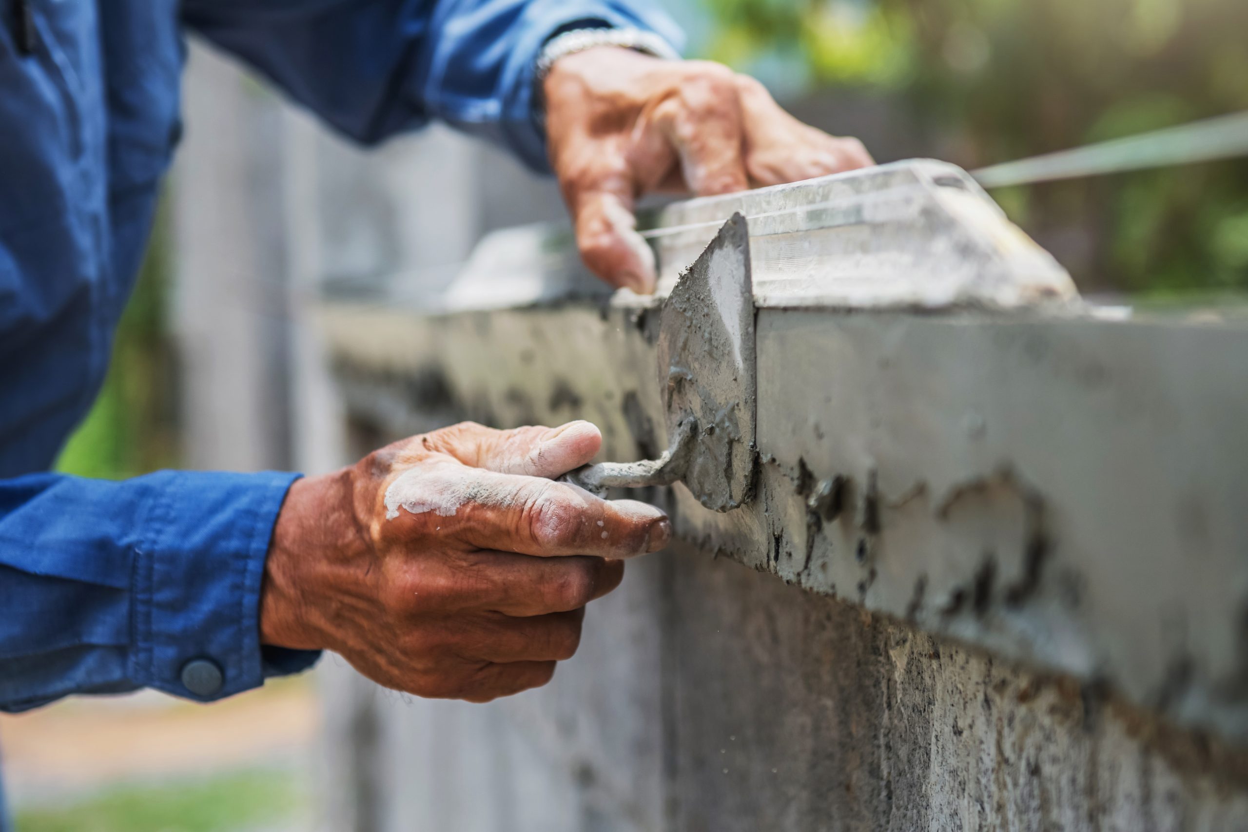 closeup hand of worker are plastering